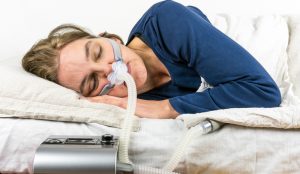 Woman Sleeping With a CPAP Machine