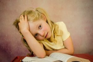 Very Tired Girl Struggling to Stay Awake at School