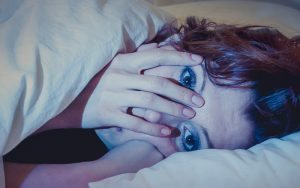 Woman Awakened by Nightmare